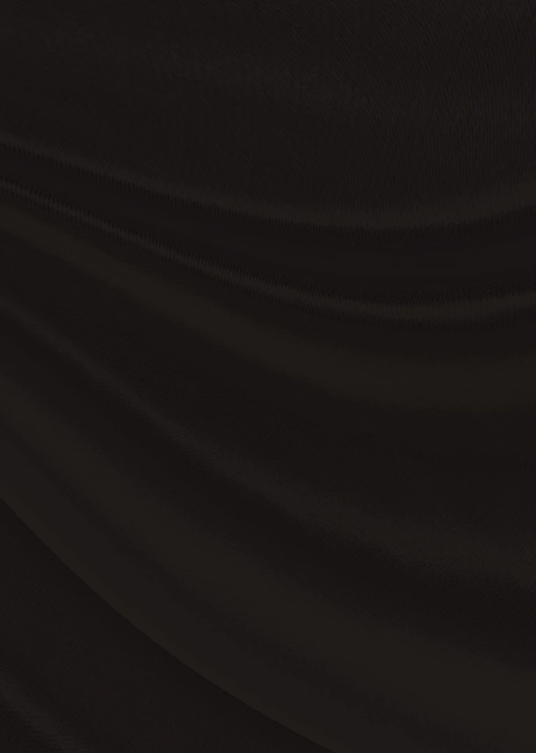 Close-up of a smooth white fabric with flowing, soft folds